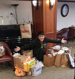 Johnny Khuu with the MICA Food Pantry food haul