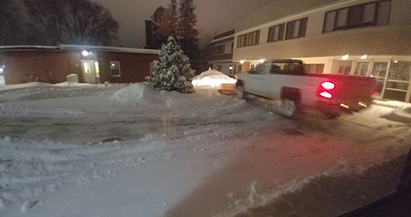 Snow storm hits Mayflower Community - snow while being cleared