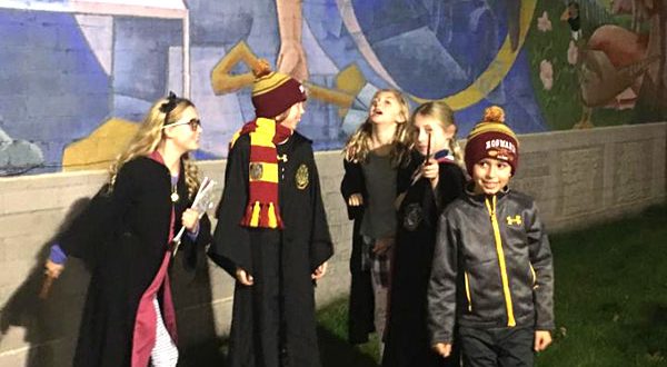 Kids dressed in Harry Potter attire for the Hogwarts show at the Railway express