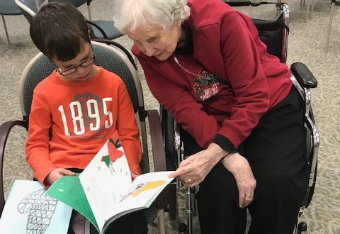 Lorene Morrison reading with a student from Bailey Park Elementary School