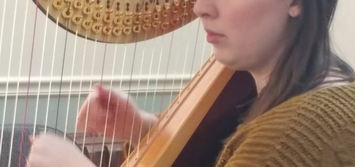 Laura Tuggle playing harp