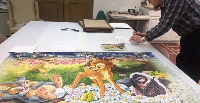 John Noer finishing Bambi, the 6th frame of his 40,000 piece Disney puzzle.