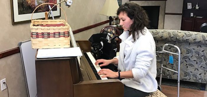 Katie In playing piano in Beebe