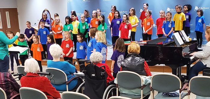 Children's choir performs for Mayflower residents.