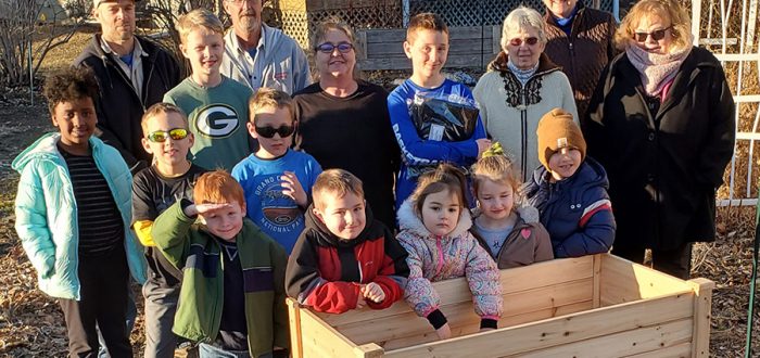 Malcolm-Sheridan Youth and After School Program delivers raised flower beds to Mayflower Community