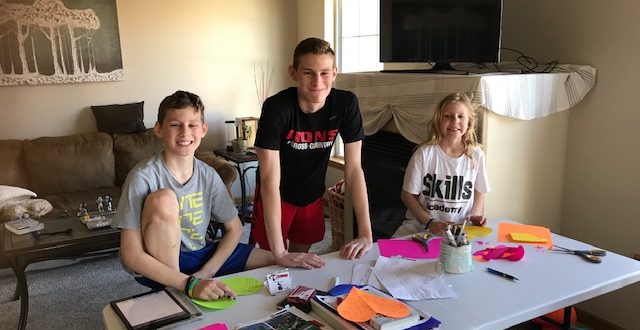 Grady, Jackson and Reese Anderson making greeting cards.