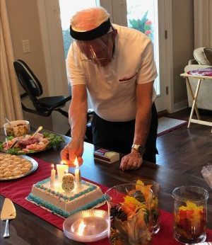 Dick Vogel lights birthday candles