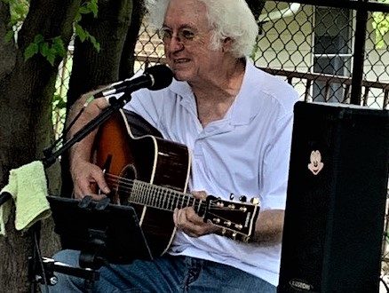 Bill Lawyer playing guitar in Beebe Circle