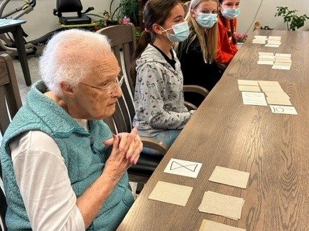 Katie Hoisington playing card games with residents