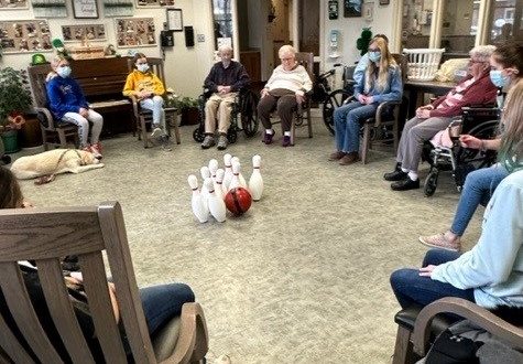 Grinnell Middle School students bowl with residents
